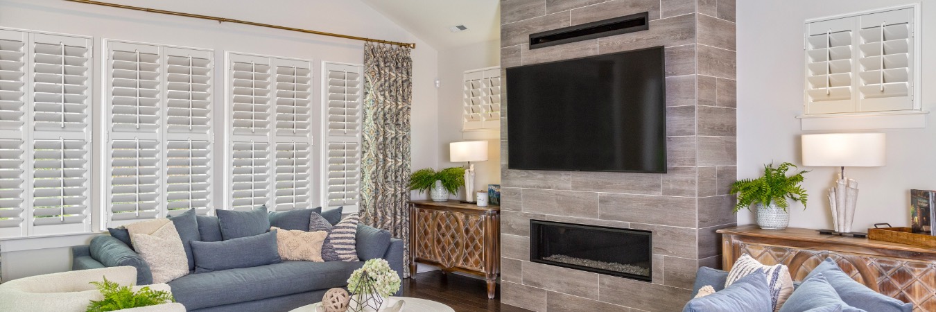 Plantation shutters in Highland family room with fireplace