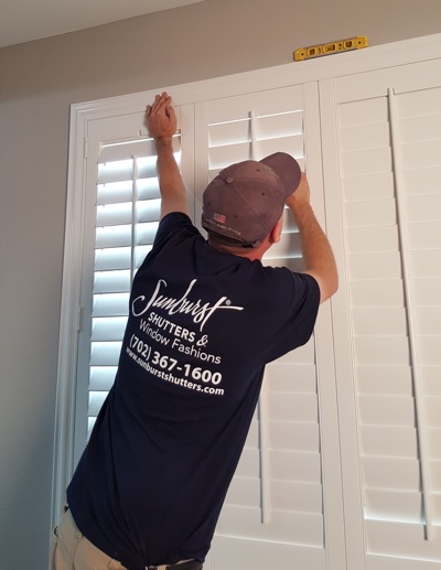 Shutter installation in Salt Lake City bedroom.