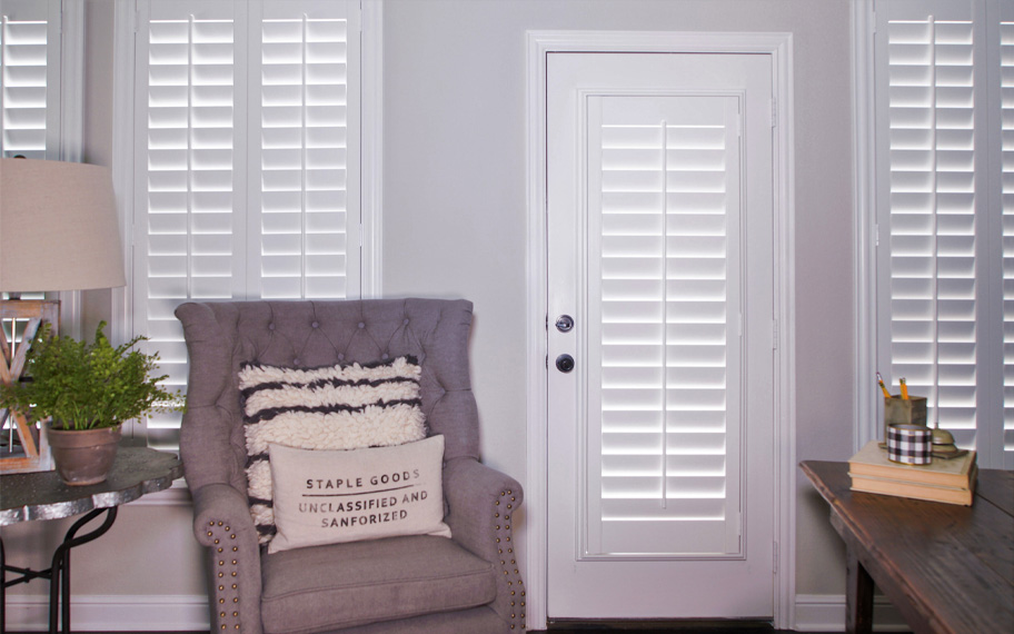 Interior shutters are beautiful and durable window treatments for glass doors in Salt Lake City. Polywood shutters on a door