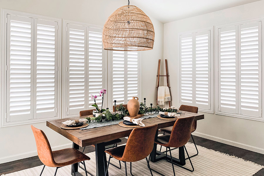 White Polywood shutters in a large dining area.