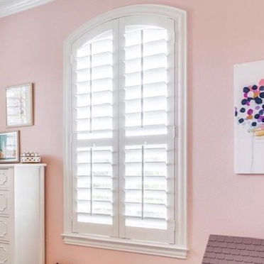 Louvered arch eyebrow window