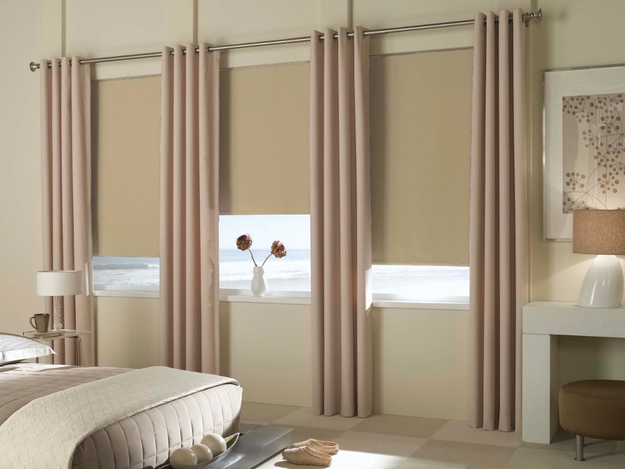 Tan blackout shades in a bedroom
