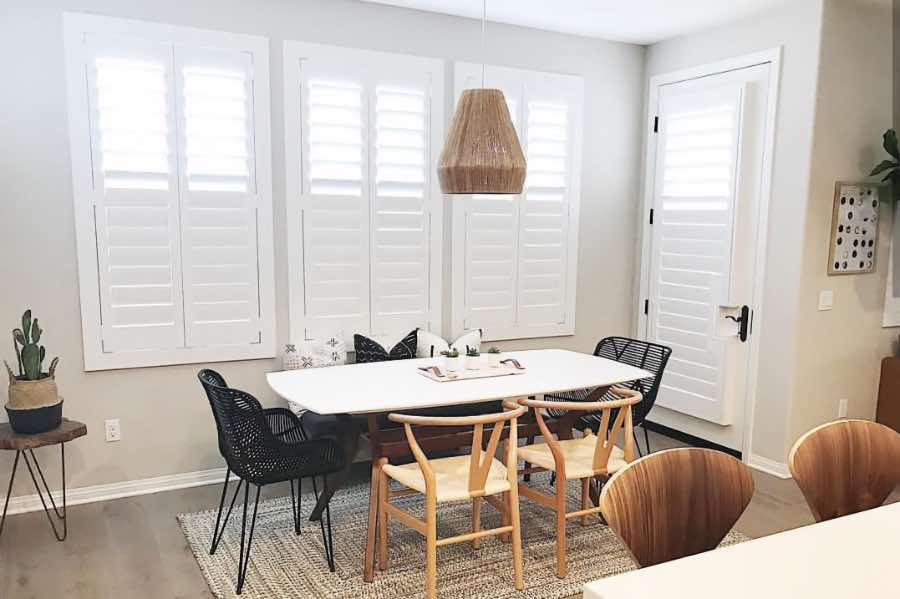 Use Polywood shutters to control natural light levels in your Salt Lake City dining room. Polywood shutters with top louvers tilted open in a dining room