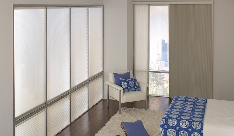 Cell shades are another option to support a minimalist design. Cellular shades in a modern bedroom.