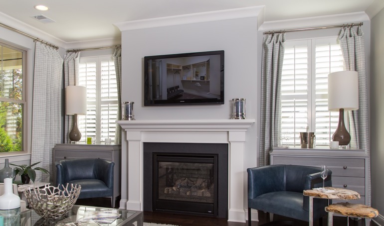 With the proper planning, your fireplace can run its best this winter. Salt Lake City mantle with white shutters.