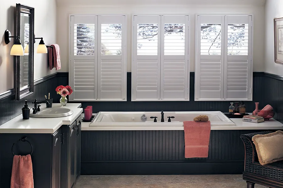 White Polywood shutters on a bathroom window